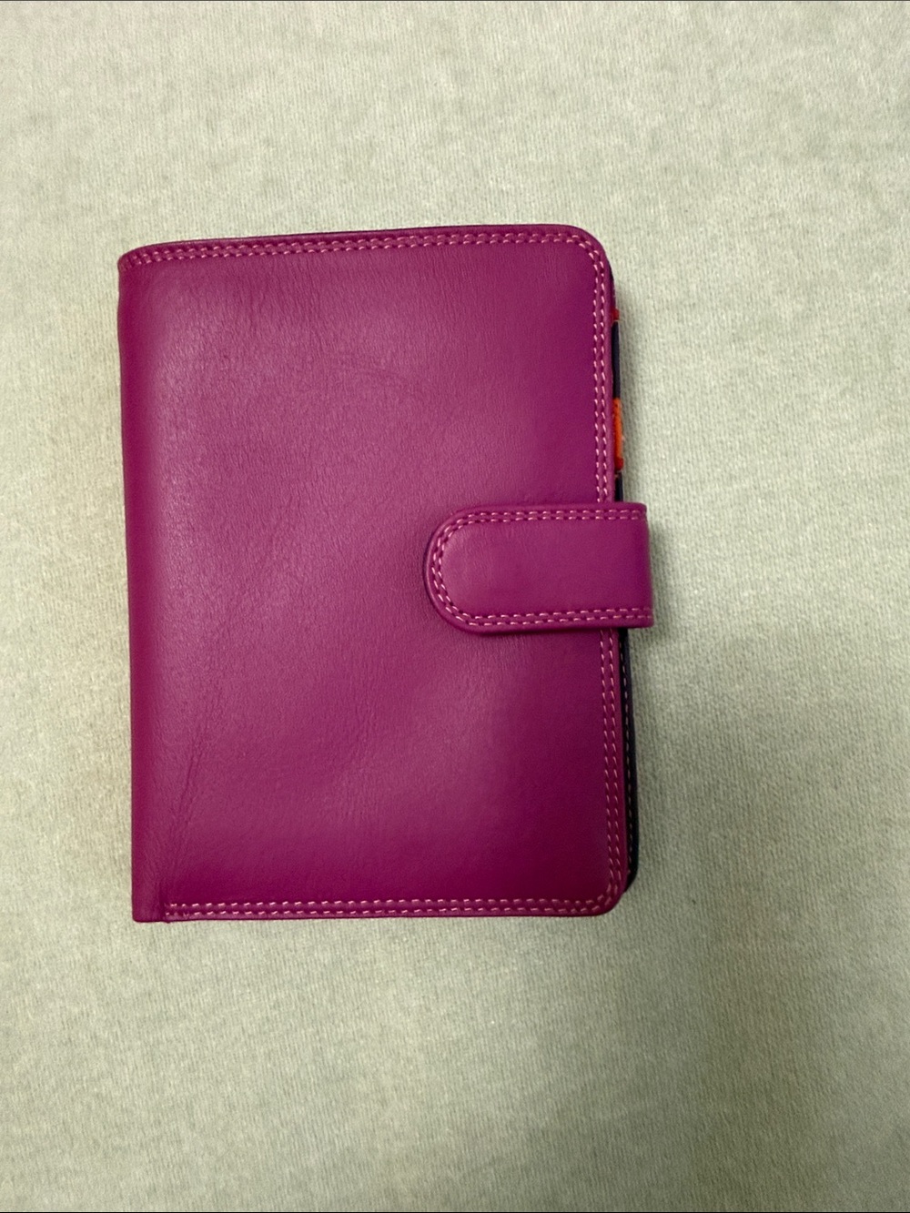 Magenta wallet with magnetic clasp